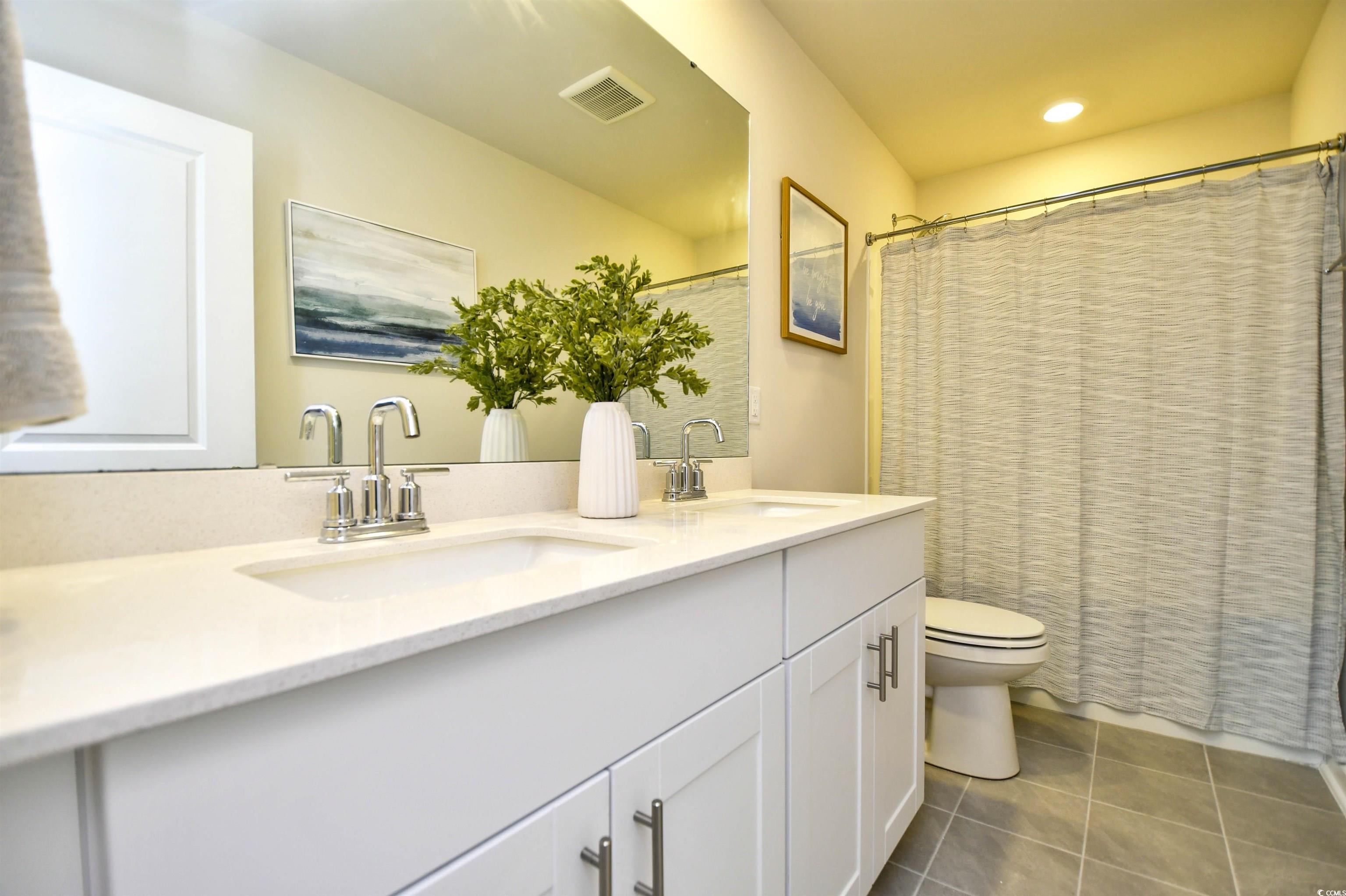 2325 Copper Crk Loop Longs, SC 29568 - Photo 33 of 40 Bathroom featuring light tile patterned floors and a sink