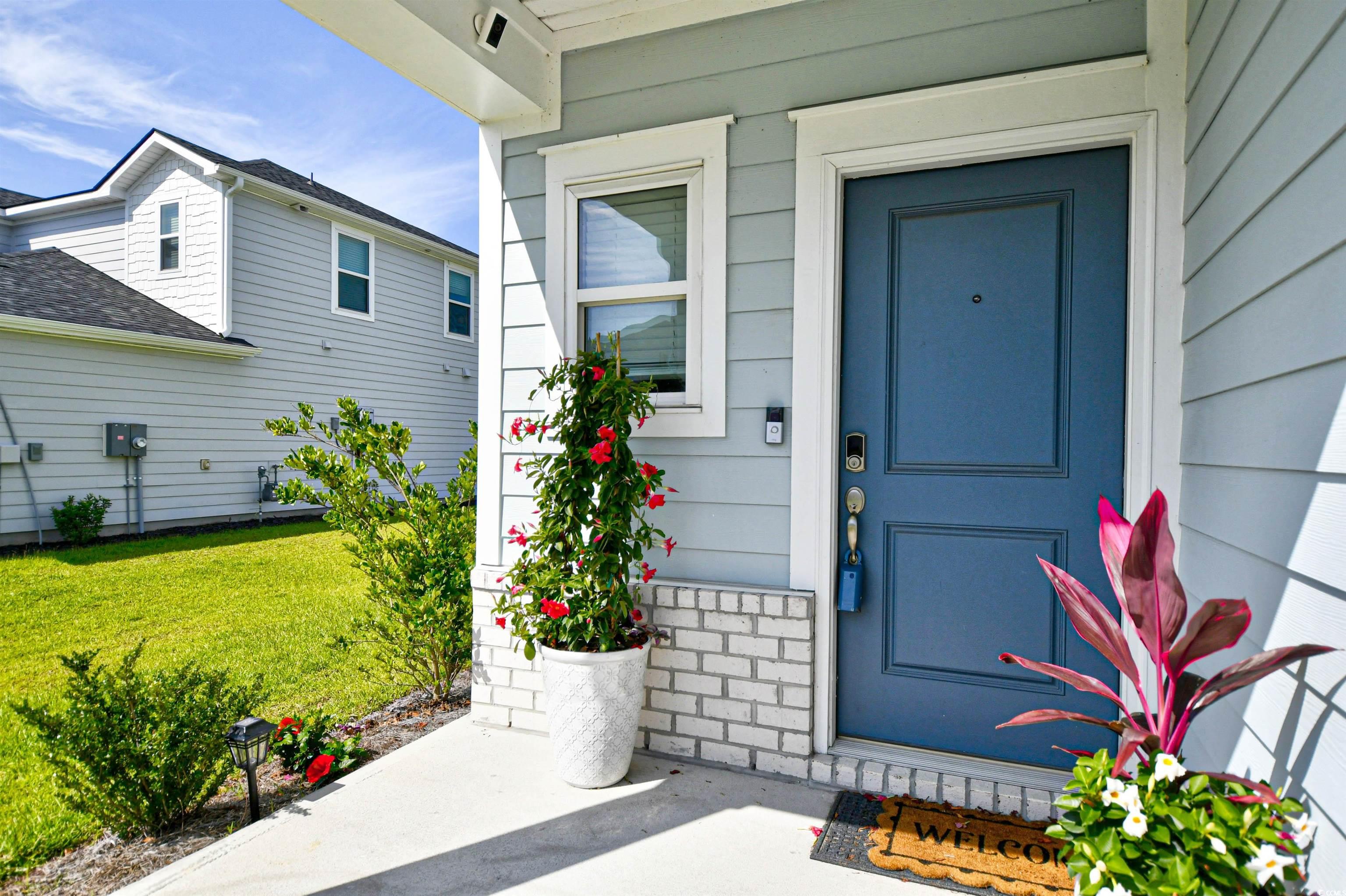 2325 Copper Crk Loop Longs, SC 29568 - Photo 4 of 40 Doorway to property featuring a yard