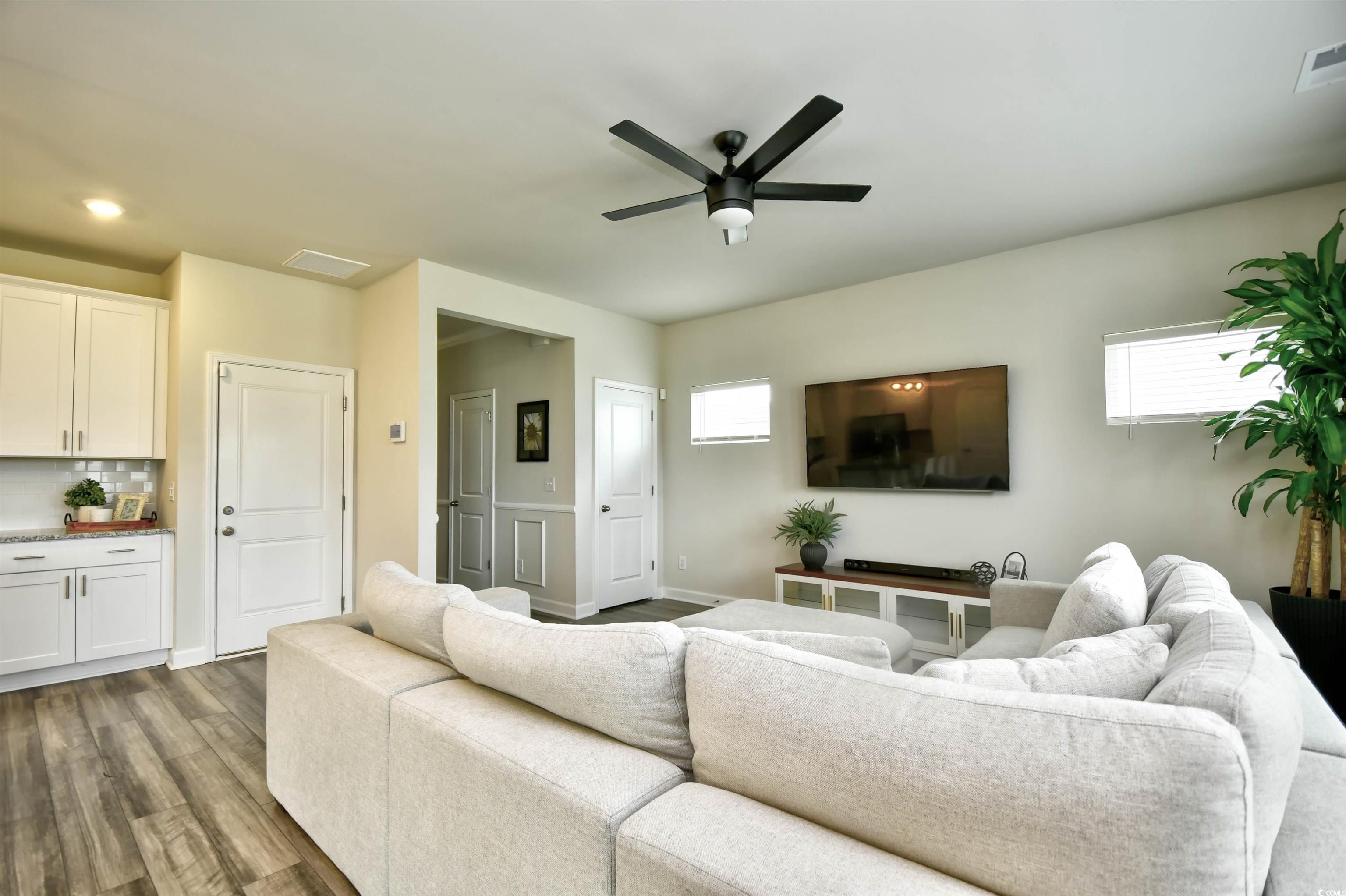 2325 Copper Crk Loop Longs, SC 29568 - Photo 8 of 40 Living room featuring wood finished floors and a ceiling fan
