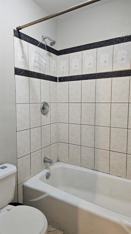 2514 Lemon Tree Lane, Unit I Orlando, FL 32839 - Photo 8 of 10 a bathroom with a toilet and shower