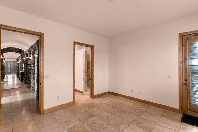 2464 East Granite Way St. George, UT 84790 - Photo 71 of 106 Unfurnished bedroom featuring plenty of natural light and arched walkways