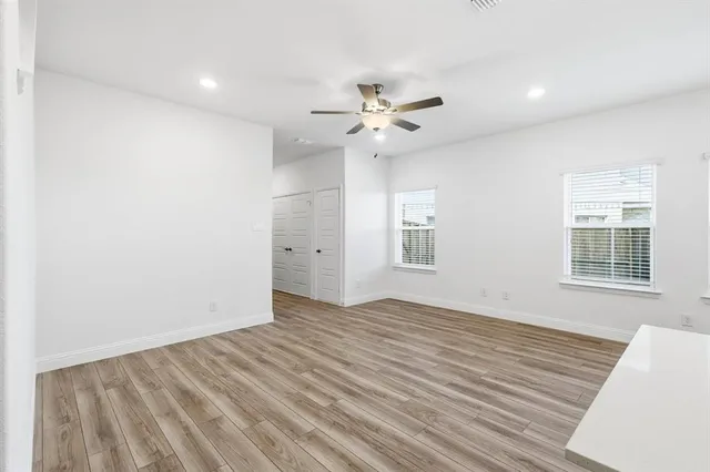 a view of kitchen with granite countertop cabinets stainless steel appliances and a window
