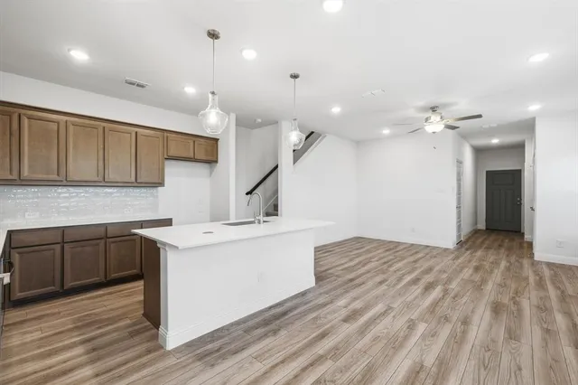 a view of a kitchen with a sink and dishwasher with kitchen view