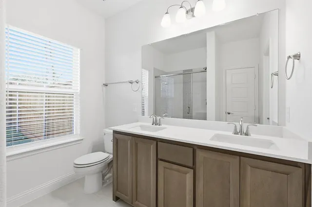 a kitchen with a sink stove and wooden cabinets