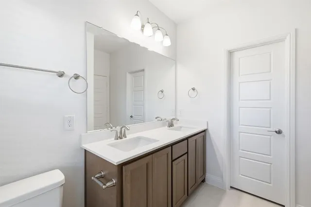 a view of a kitchen with a sink and wooden floor