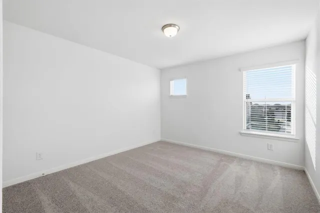 a bathroom with a sink a toilet and a large mirror