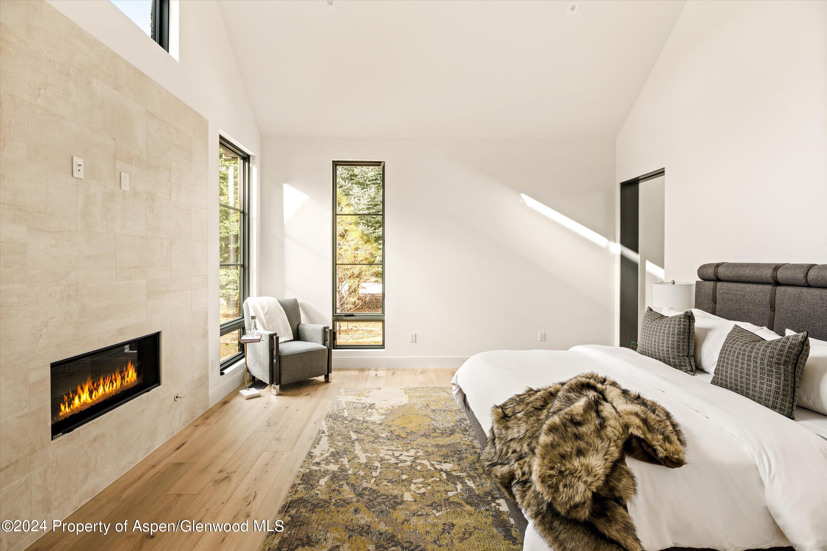 505 Diamond A Ranch Road Carbondale, CO 81623 - Photo 18 of 33 a bedroom with a bed and a couch