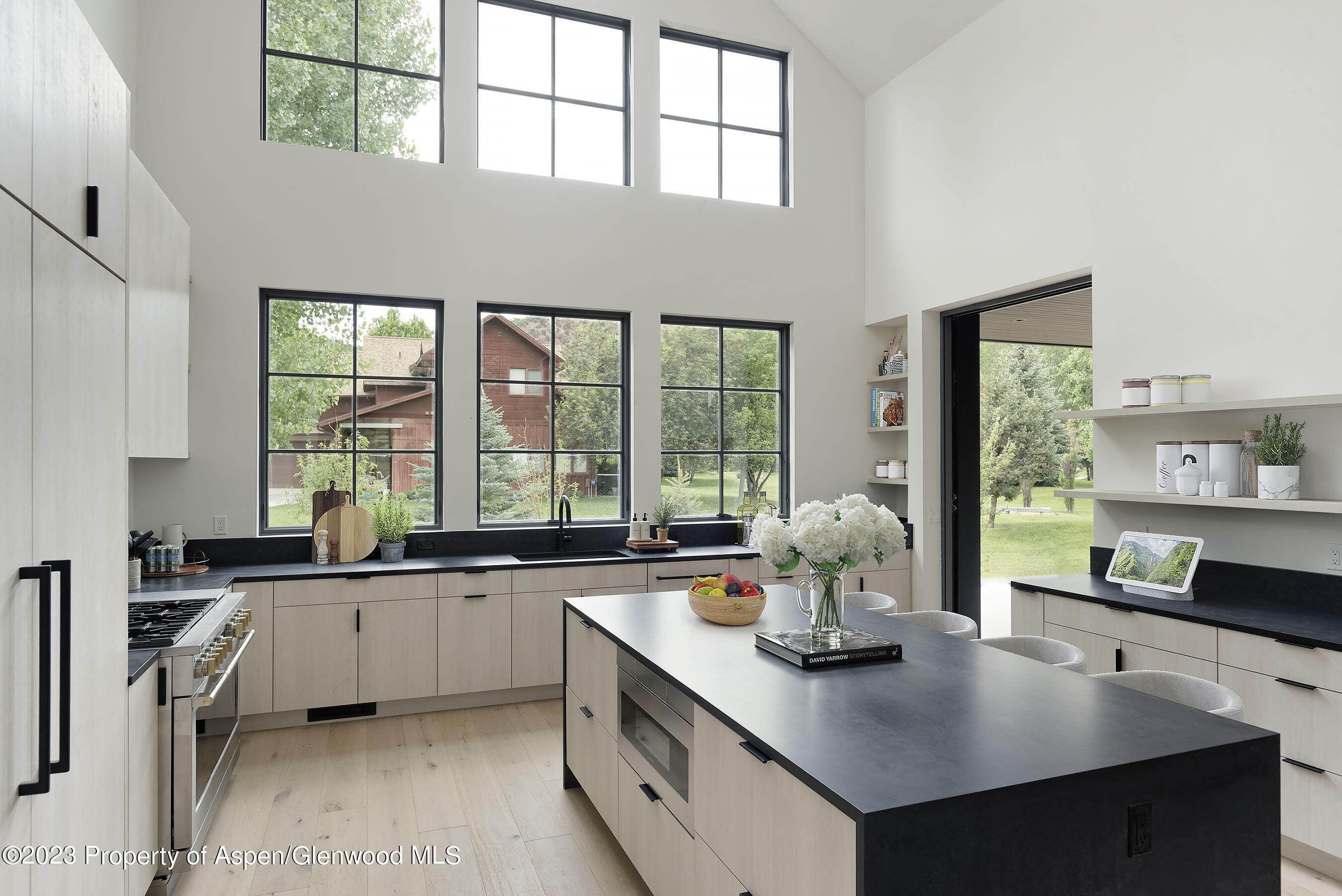 505 Diamond A Ranch Road Carbondale, CO 81623 - Photo 24 of 33 a view of kitchen island a sink and living room with a large window