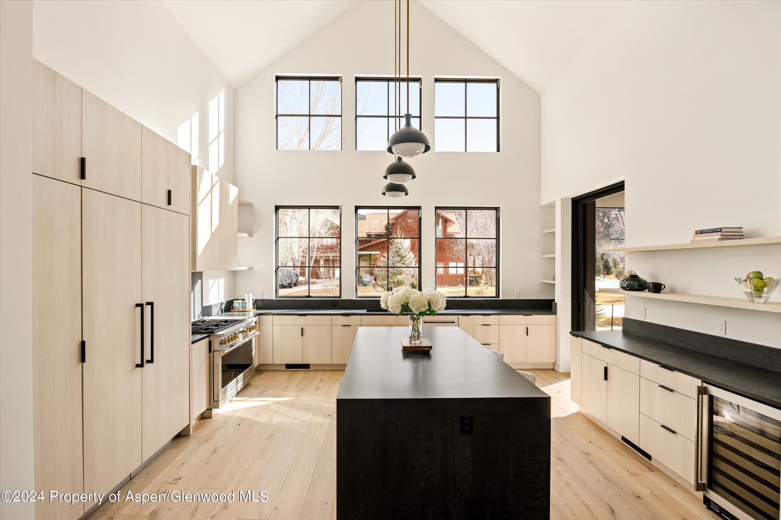 505 Diamond A Ranch Road Carbondale, CO 81623 - Photo 3 of 33 a large white kitchen with a large window