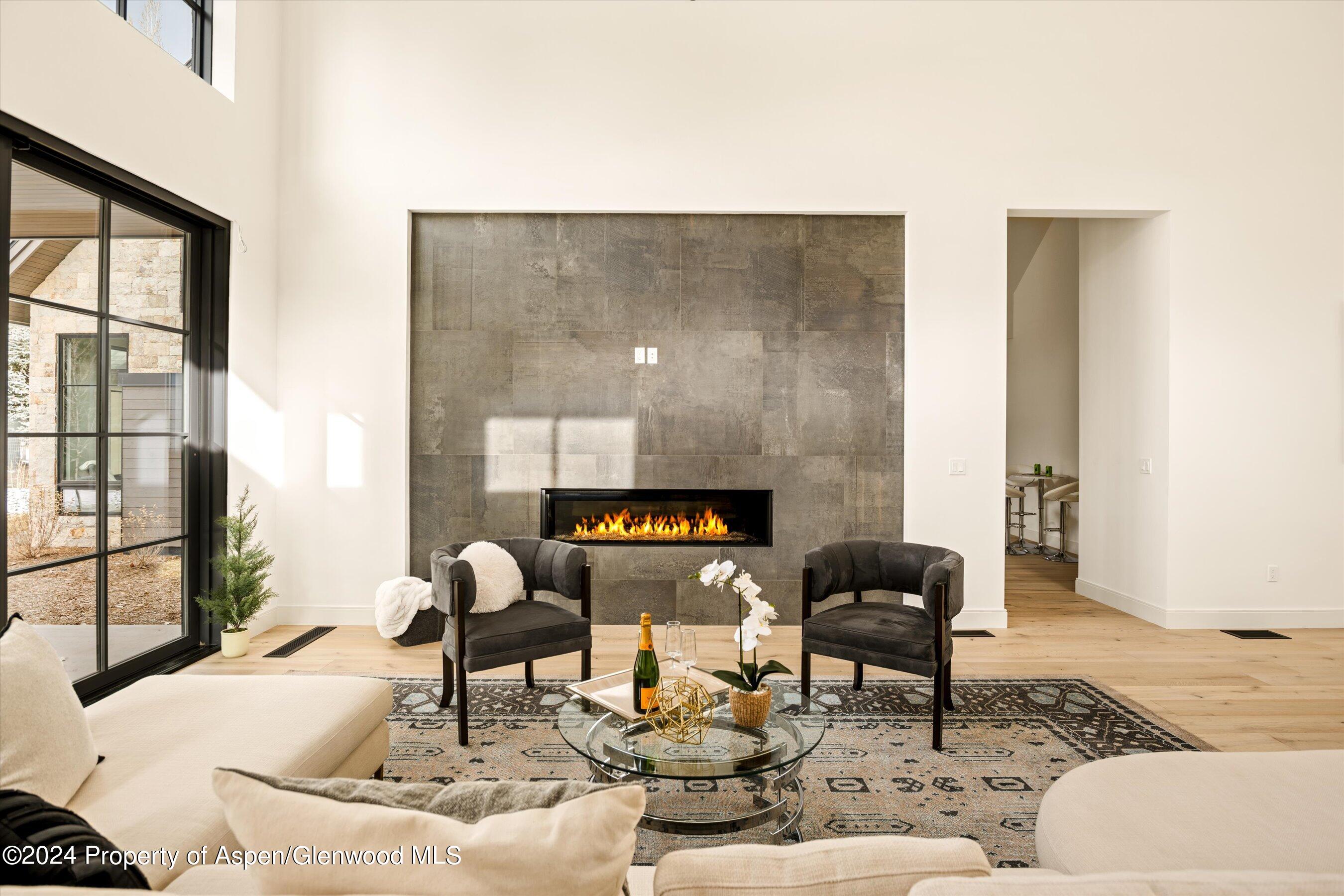 505 Diamond A Ranch Road Carbondale, CO 81623 - Photo 9 of 33 a living room with furniture and floor to ceiling windows