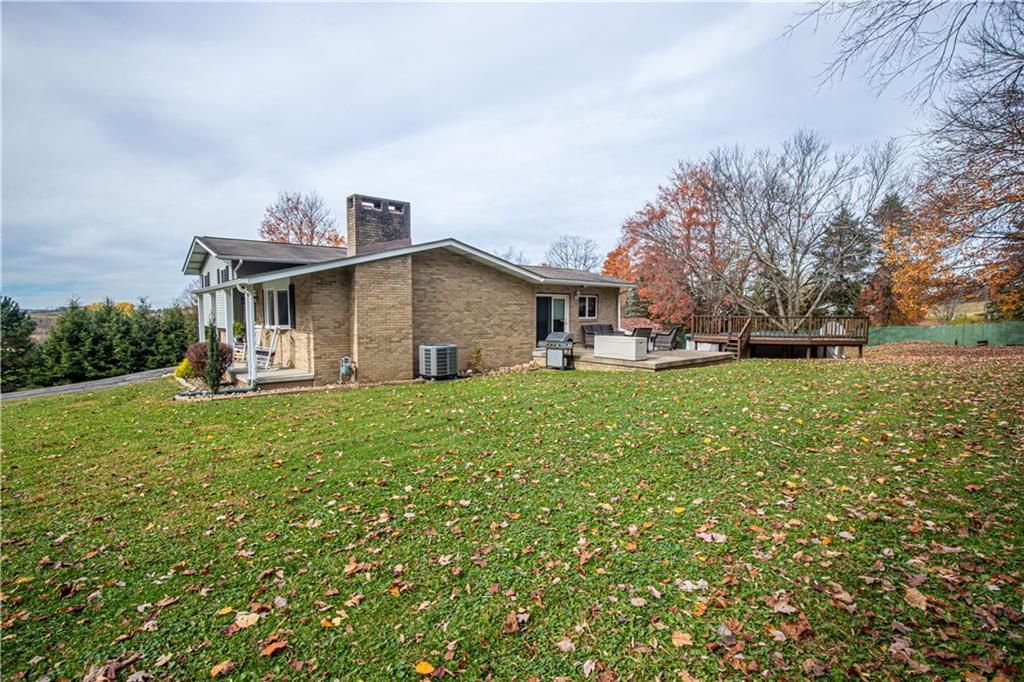 178 Kaider Road Uniontown, PA 15401 - Photo 5 of 17 a view of a house with a big yard and large trees