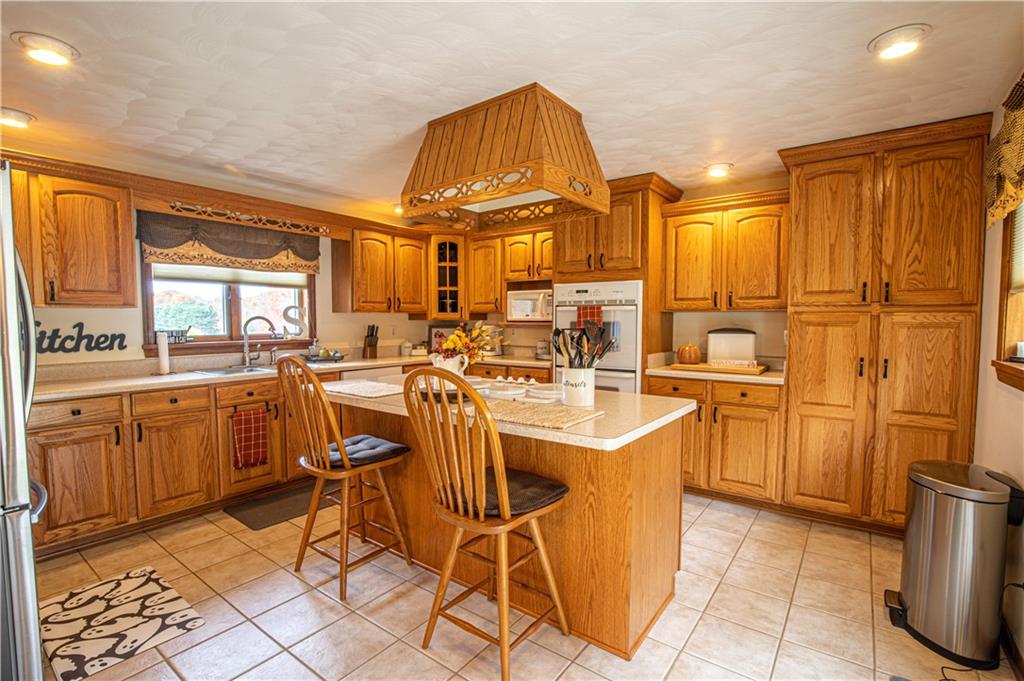 178 Kaider Road Uniontown, PA 15401 - Photo 6 of 17 a kitchen with stainless steel appliances a sink and cabinets