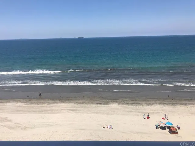 a view of an ocean and mountain