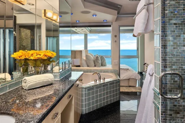 a view of a buildings and cars parked in front of it