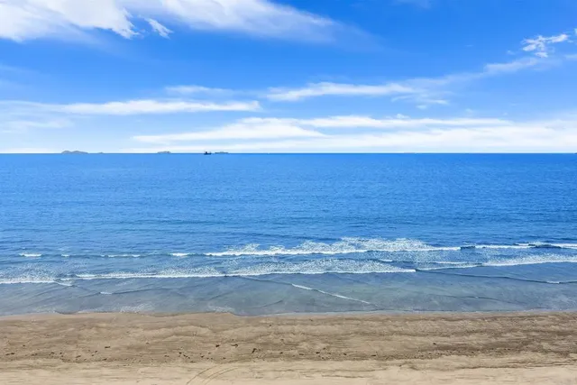a view of balcony with wooden floor