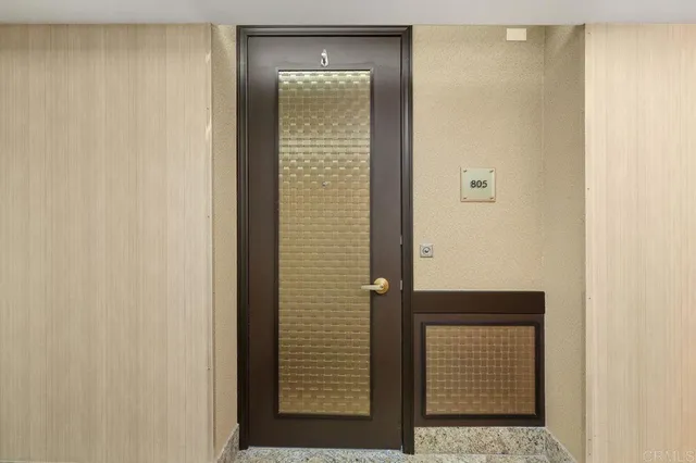 a kitchen with stainless steel appliances granite countertop a refrigerator a stove and a sink