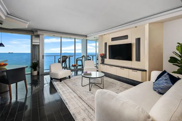 a large bed sitting in a bedroom next to a window