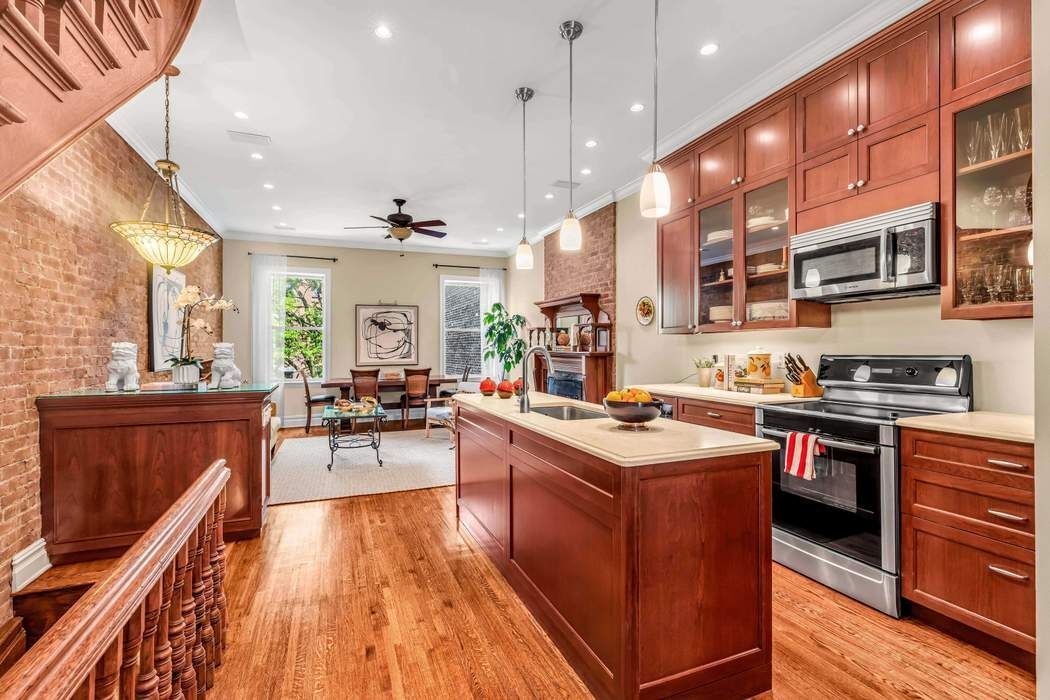 a kitchen with stainless steel appliances granite countertop lots of counter top space