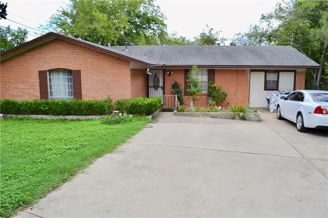 a front view of a house with a yard and porch