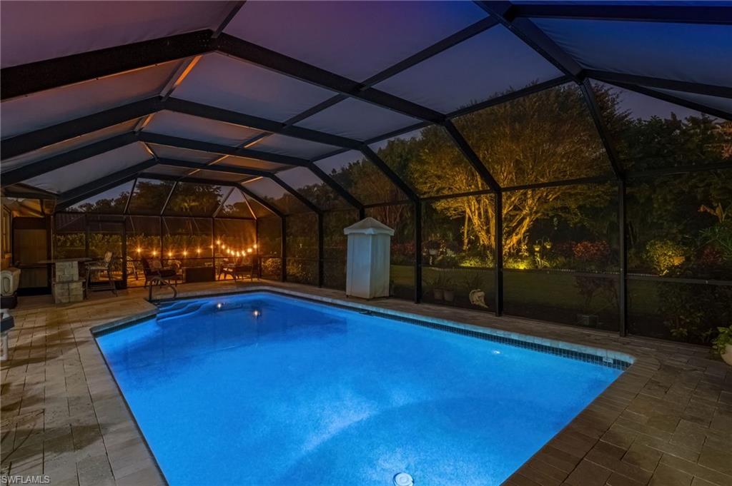 2236 Queens Boulevard Naples, FL 34112 - Photo 1 of 34 a view of a patio with a table and chairs