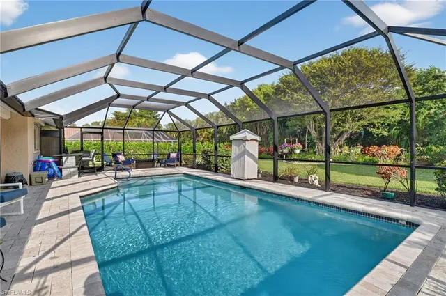 a view of a swimming pool with sitting area