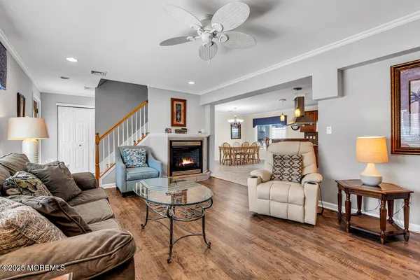 a living room with furniture and a lamp