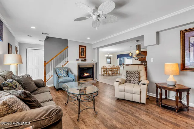 a living room with furniture and a lamp
