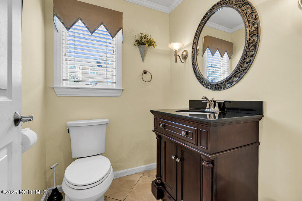 2 A Holiday Road Seaside Heights, NJ 08751 - Photo 13 of 50 a bathroom with a toilet a sink and a mirror