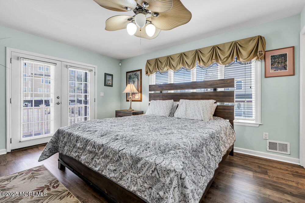 2 A Holiday Road Seaside Heights, NJ 08751 - Photo 17 of 50 a bedroom with bed and wooden floor