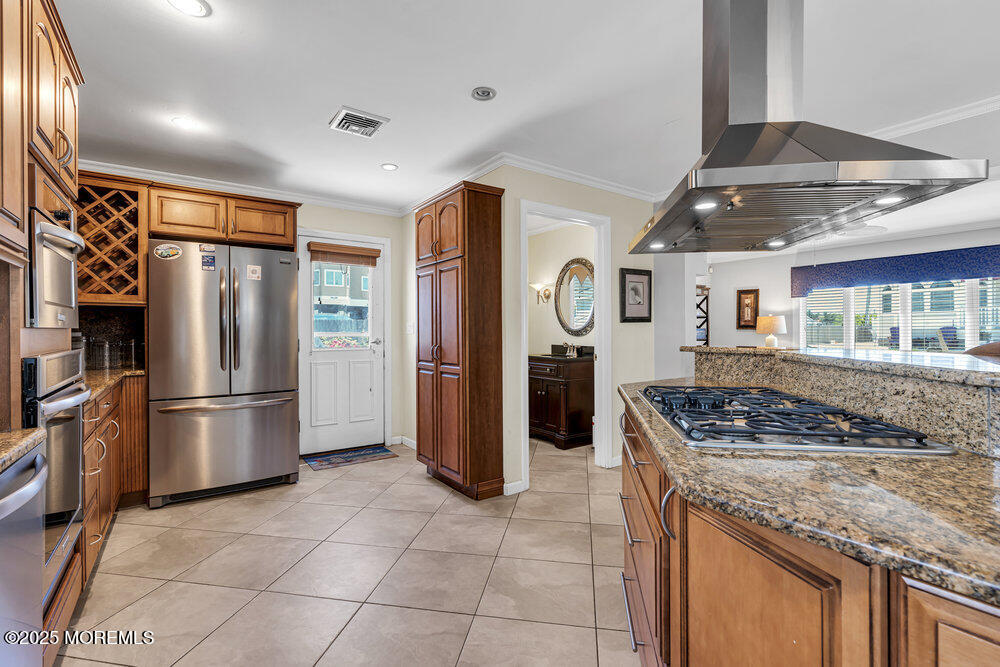 2 A Holiday Road Seaside Heights, NJ 08751 - Photo 19 of 50 a kitchen with stainless steel appliances granite countertop a refrigerator and a stove top oven