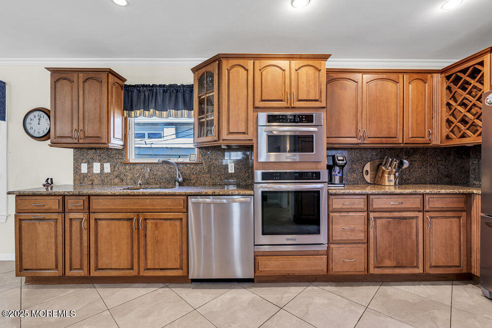 2 A Holiday Road Seaside Heights, NJ 08751 - Photo 21 of 50 a kitchen with stainless steel appliances granite countertop a stove and cabinets