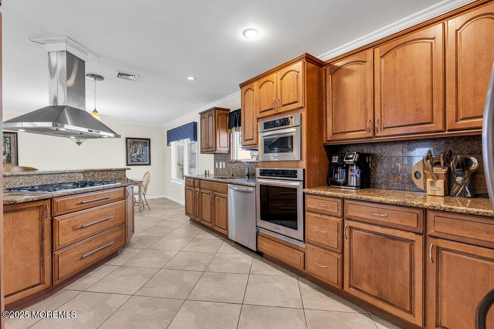 2 A Holiday Road Seaside Heights, NJ 08751 - Photo 22 of 50 a kitchen with stainless steel appliances granite countertop a stove top oven a sink and dishwasher