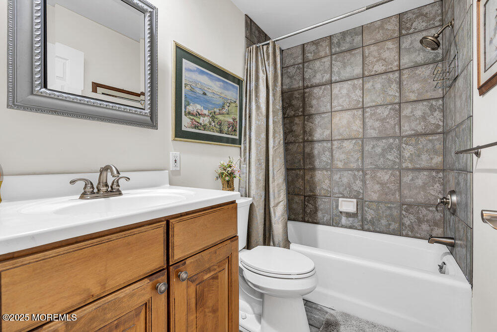 2 A Holiday Road Seaside Heights, NJ 08751 - Photo 27 of 50 a bathroom with a sink a toilet and shower