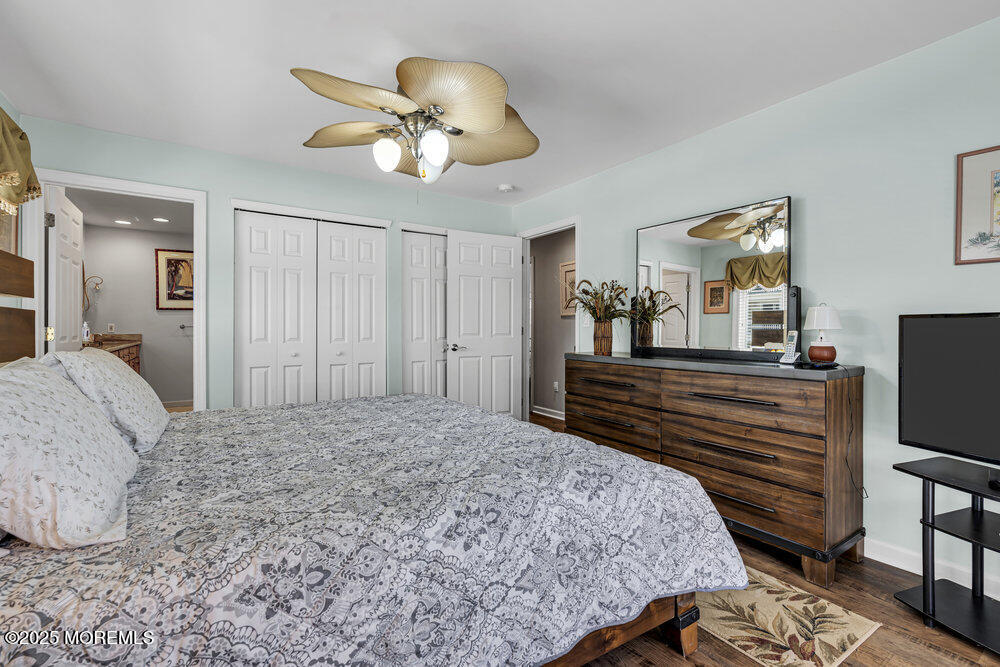 2 A Holiday Road Seaside Heights, NJ 08751 - Photo 30 of 50 a bedroom with a bed and a chandelier