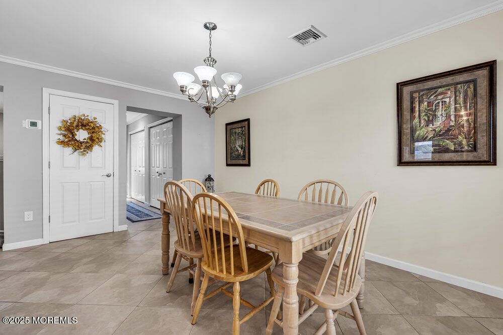 2 A Holiday Road Seaside Heights, NJ 08751 - Photo 3 of 50 a view of a dining room with furniture and chandelier