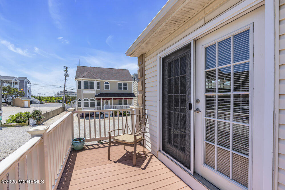 2 A Holiday Road Seaside Heights, NJ 08751 - Photo 34 of 50 a view of a deck with wooden floor and fence next to a yard