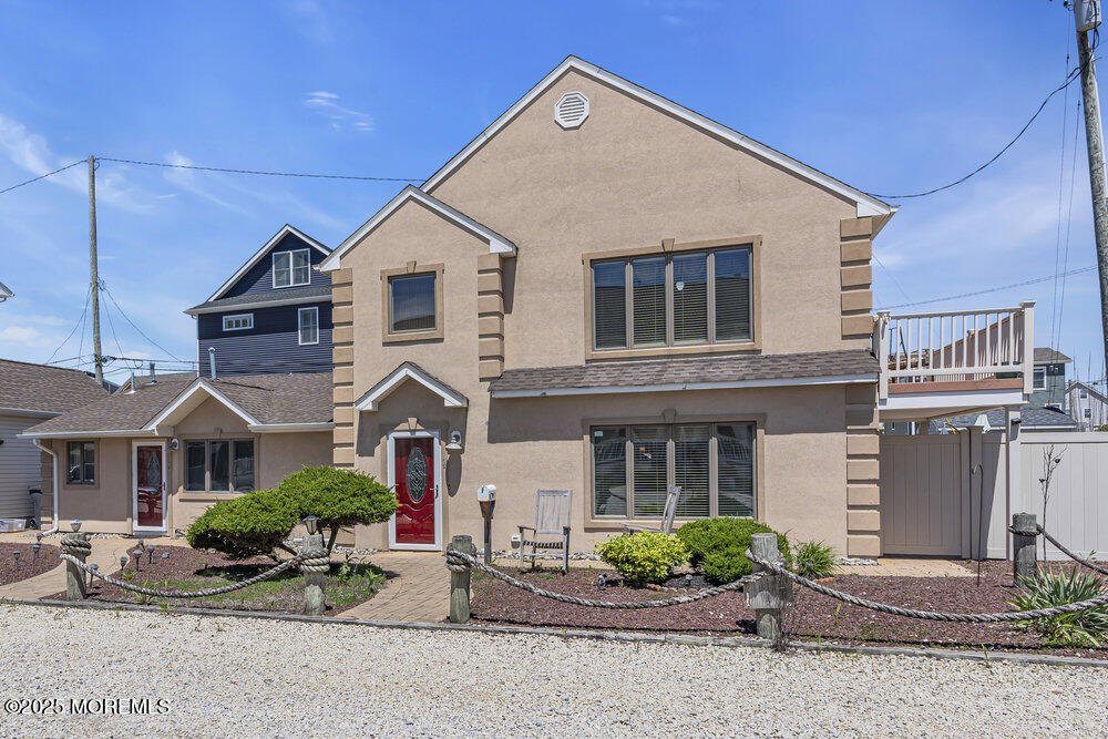 2 A Holiday Road Seaside Heights, NJ 08751 - Photo 43 of 50 a front view of a house with a yard and garage