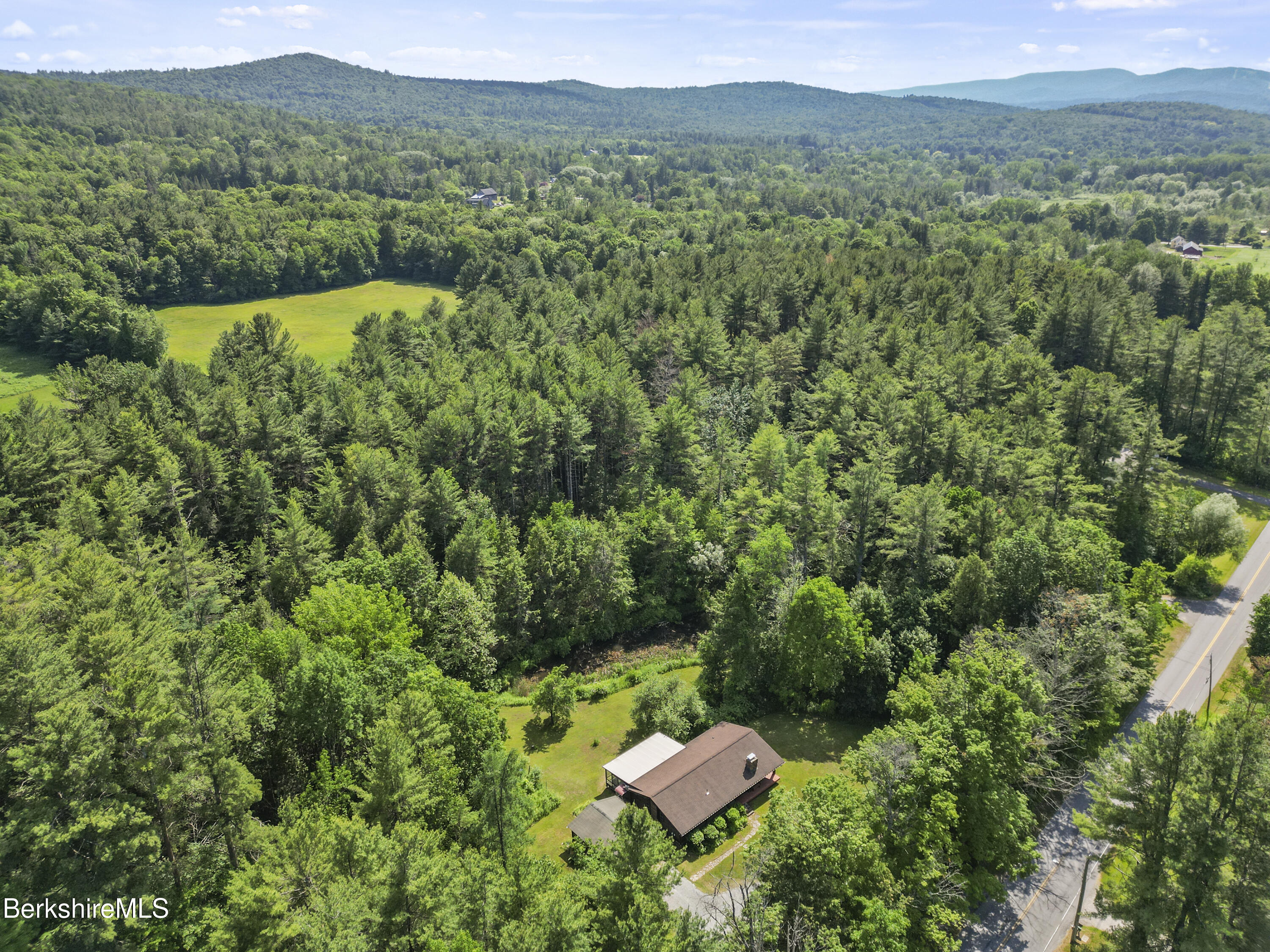 240 Kirchner Road Dalton, MA 01226 - Photo 50 of 51 a view of a lush green forest with a house