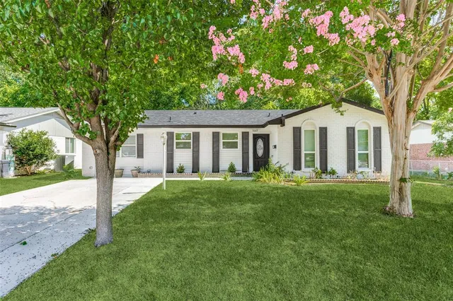 front view of a house with a yard