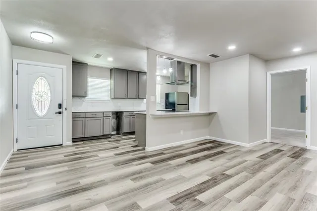 a view of a kitchen with a sink cabinets and a window