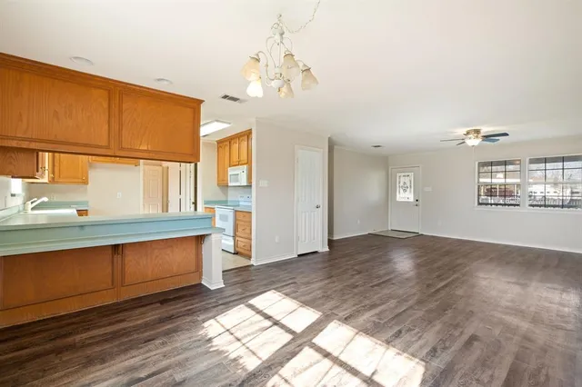 an aerial view of a houses with a yard