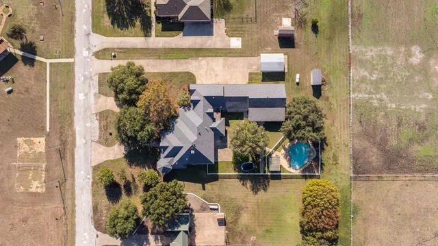a view of a swimming pool with a patio
