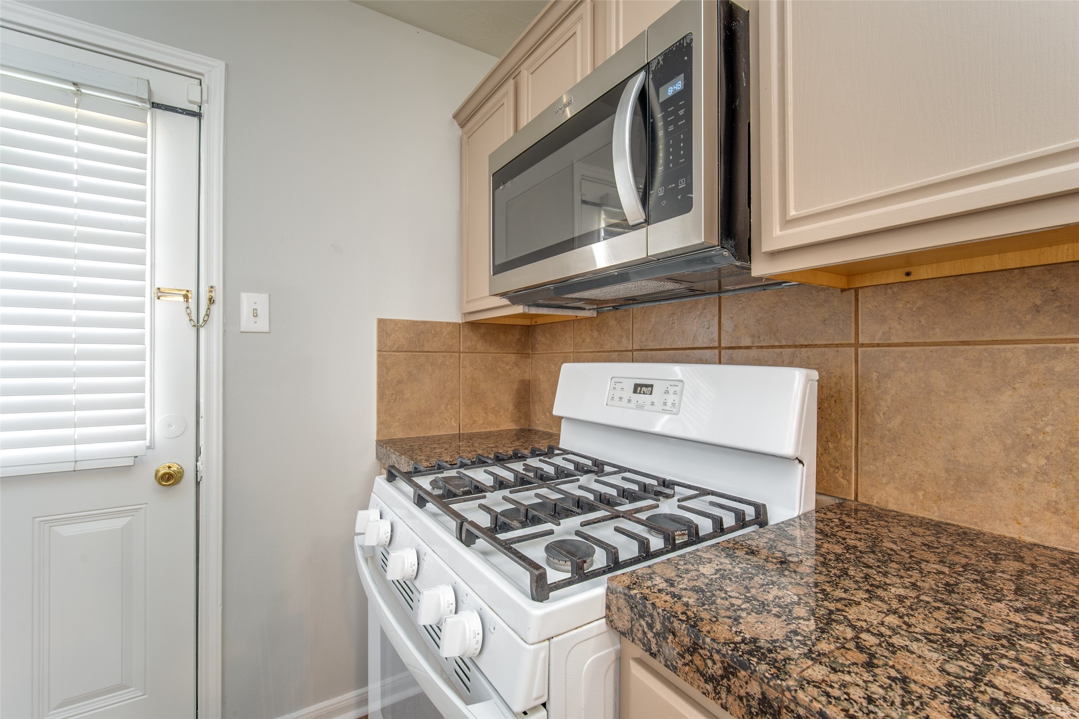 14510 Windmill Meadows Court Houston, TX 77082 - Photo 17 of 39 a stove top oven sitting inside of a kitchen