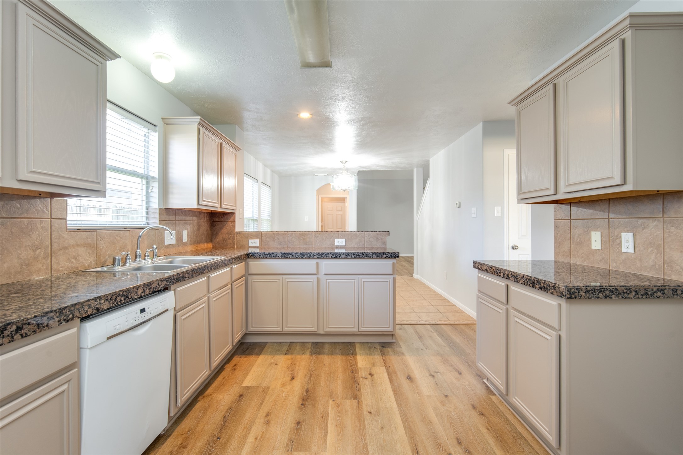 14510 Windmill Meadows Court Houston, TX 77082 - Photo 19 of 39 a kitchen with granite countertop a sink stainless steel appliances and cabinets