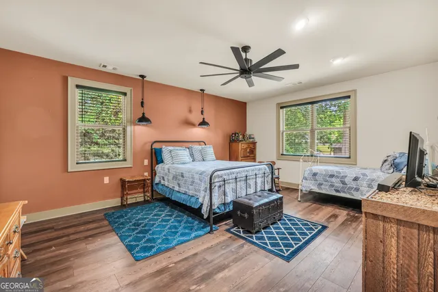 a bedroom with a bed and a bookshelf