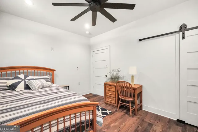 an aerial view of a house with a yard and lake view