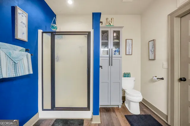 a view of a lake with couches chairs