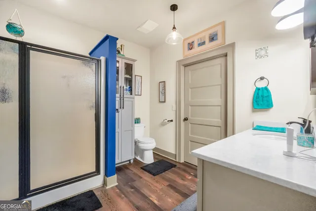 an aerial view of a house with a yard and lake view