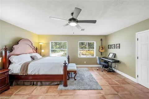 a bed room with a bed and a window