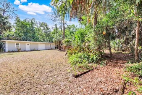 an outdoor space with patio and umbrellas